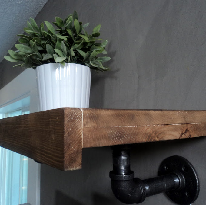 Homemade reclaimed wood and plumbers pipe shelf